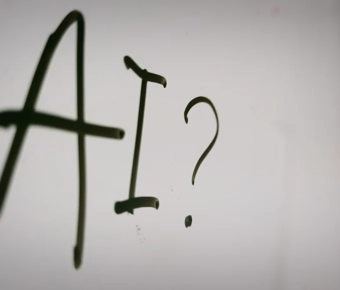 a sign with a question mark and a question mark drawn on it